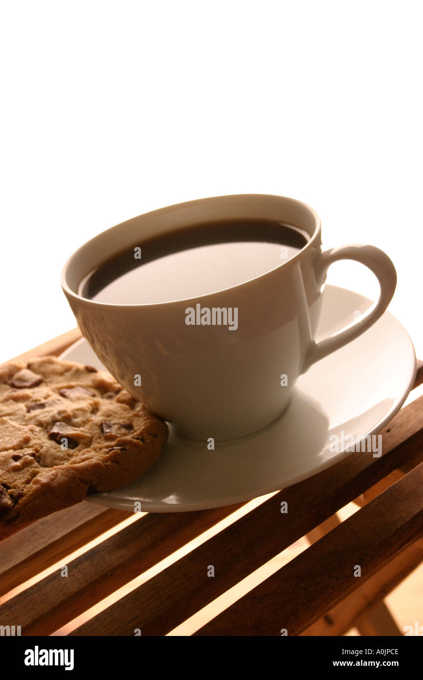 Tasse Kaffee und ein Cookie Stockfoto