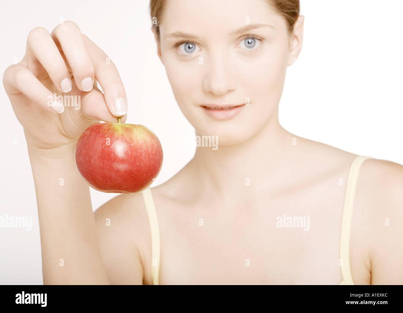 Frau mit Apfel Stockfoto