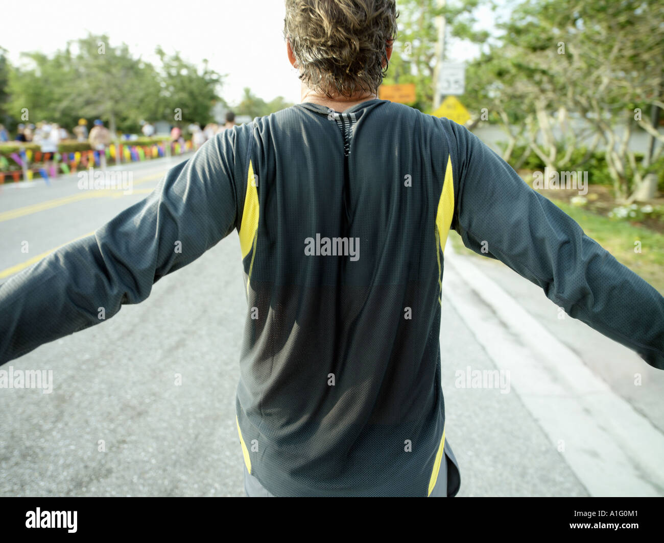 Männliche Läufer beendet Rennen Stockfoto