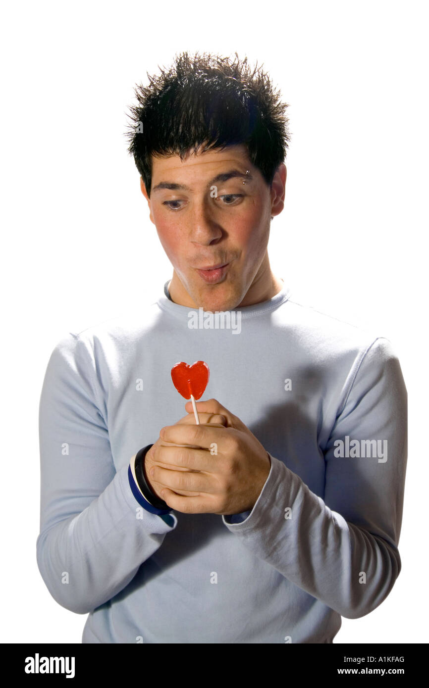 junger Mann mit Herz candy Stockfoto