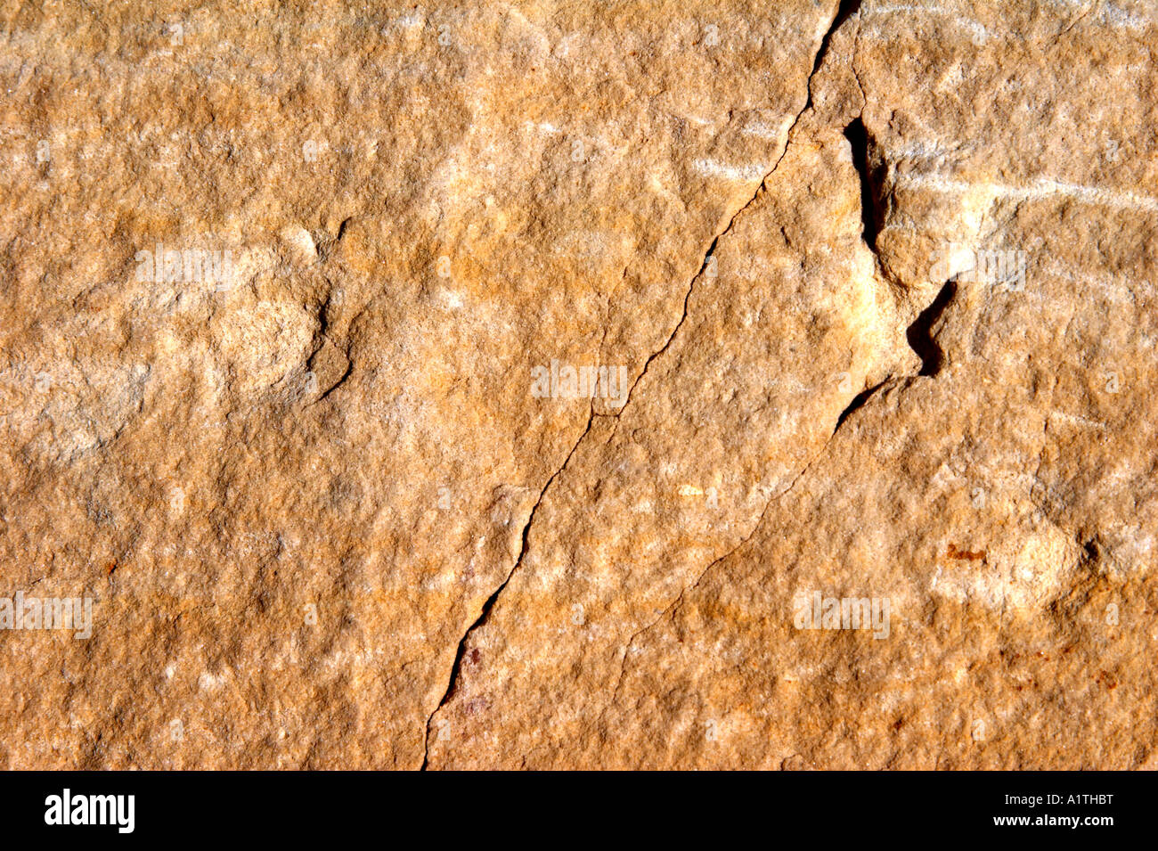 Rötliche, gelbliche Sandstein - Steinoberfläche Stockfoto
