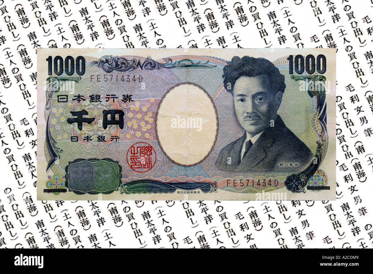 Ein Konzept-Bild von Japan 1000 Yen Hinweis vor dem schriftlichen Hintergrund. Stockfoto