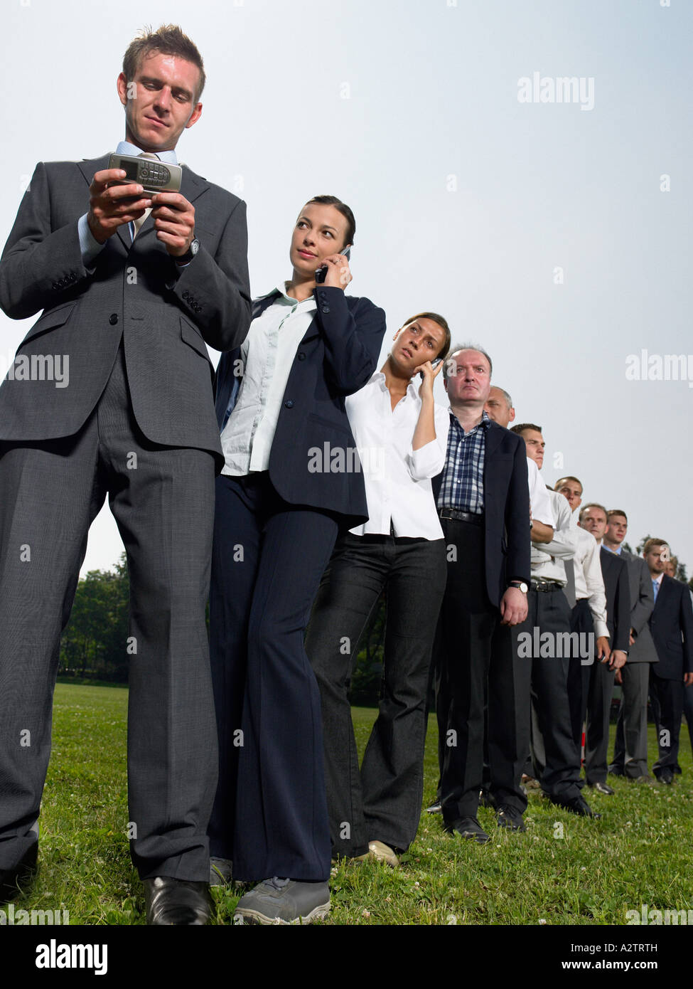 Geschäftsleute in einer Warteschlange Stockfoto