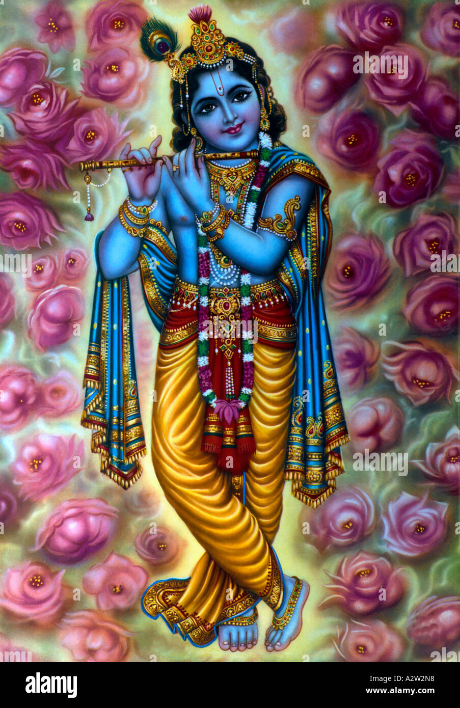 Krishna spielt die Flöte mit Roses Stockfoto