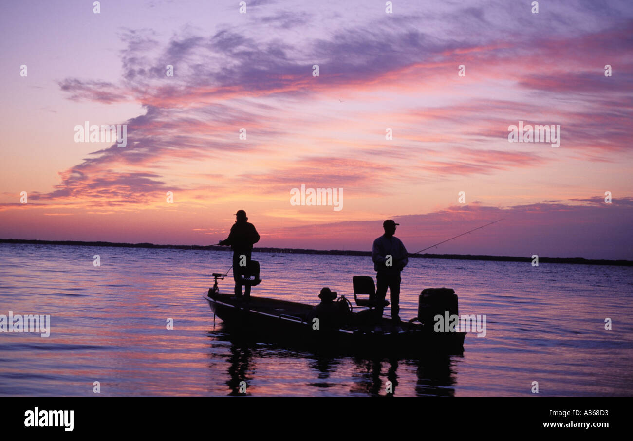 Fischer grüßen den Sonnenaufgang am See Weohyakapka in Polk County in Florida Stockfoto