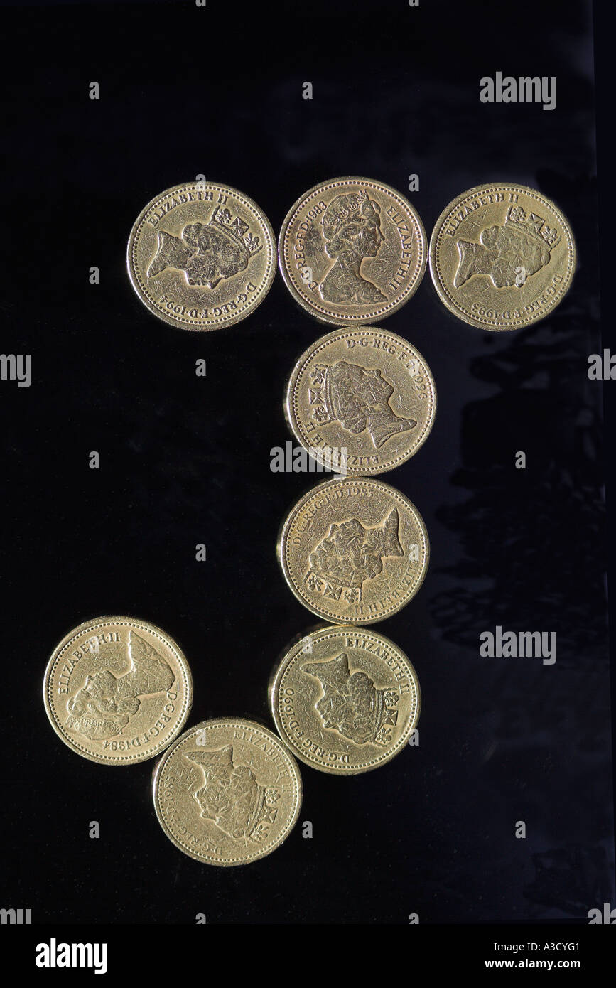 BRITISH POUND MÜNZE FONT BUCHSTABEN J AUF SCHWARZ Stockfoto