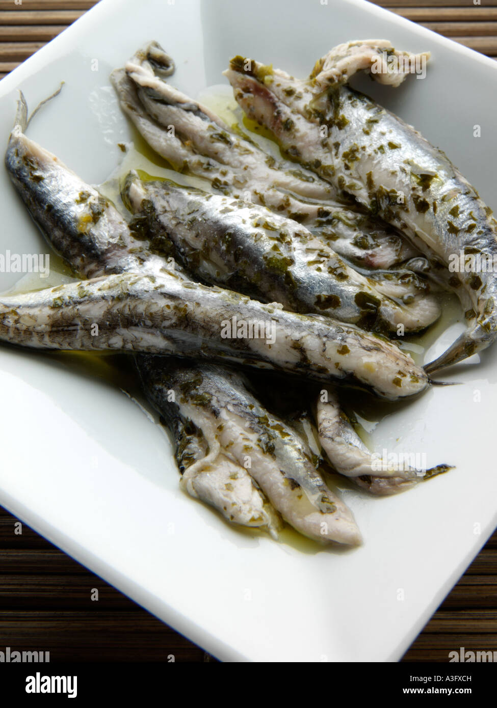 Oily fish anchovy fillets boquerones Fotos und Bildmaterial in hoher