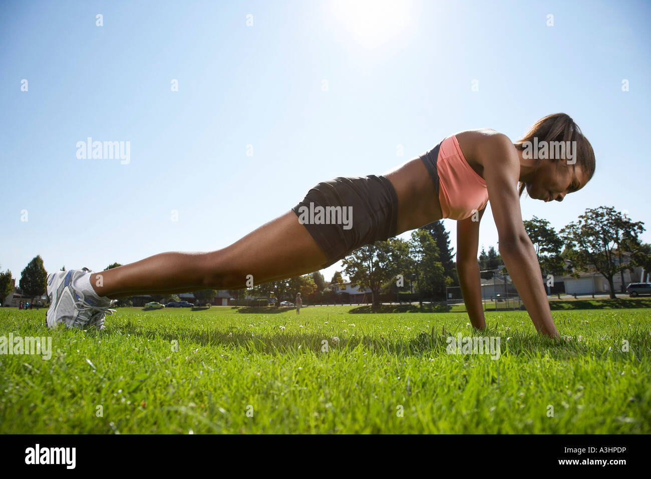 Girl Doing Push-ups Stockfoto