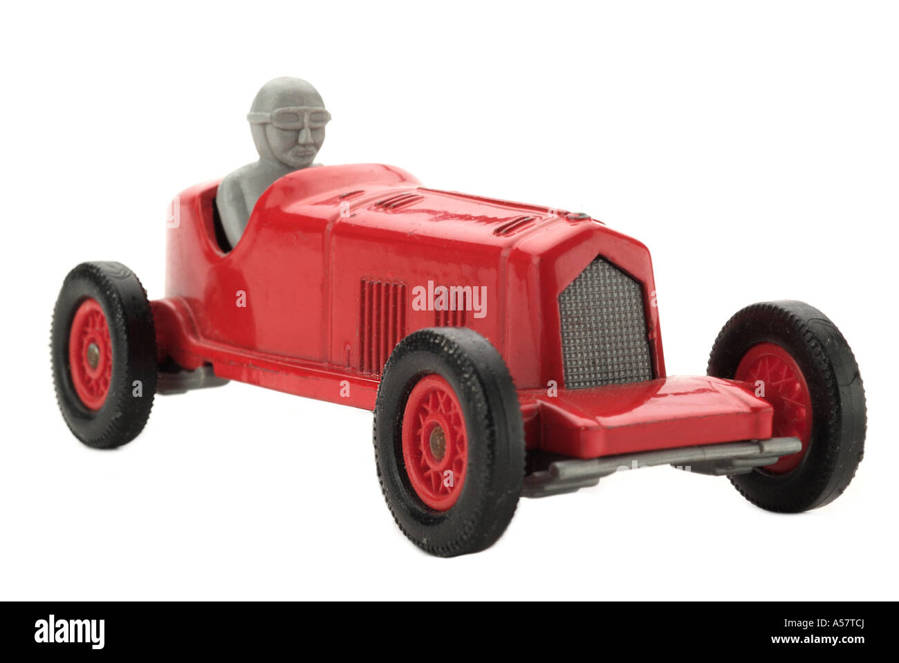 Roter Spielzeug Rennwagen alt altmodisch 1930 Geschwindigkeit gefahren Auto Profil Fahrzeugseite auf Sport Rennen junge Mann Männer Oldtimer Automobil Stockfoto