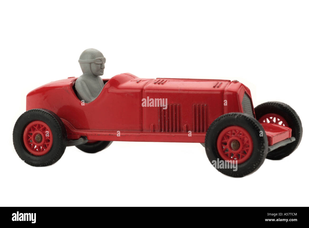 Roter Spielzeug Rennwagen alt altmodisch 1930 Geschwindigkeit gefahren Auto Profil Fahrzeugseite auf Sport Rennen junge Mann Männer Oldtimer Automobil Stockfoto