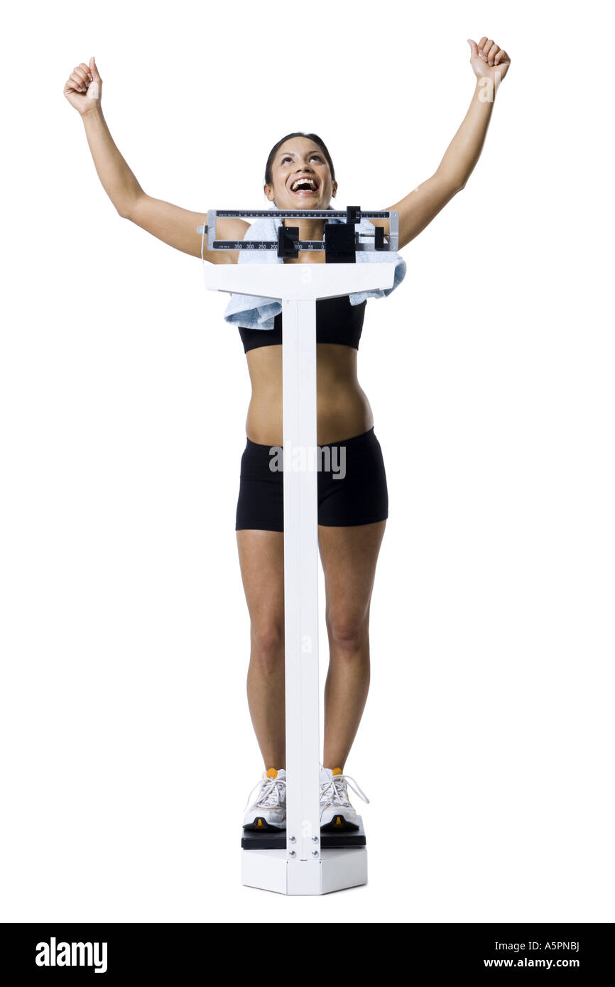 Frau wiegen sich im Maßstab Stockfoto