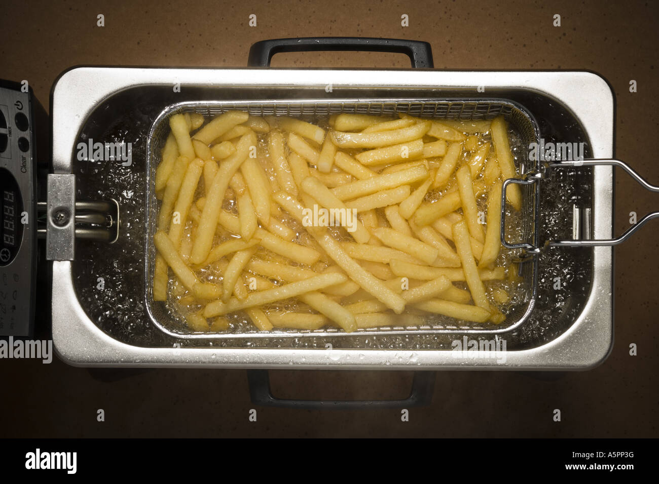 Nahaufnahme von Pommes frites Kochen Stockfoto