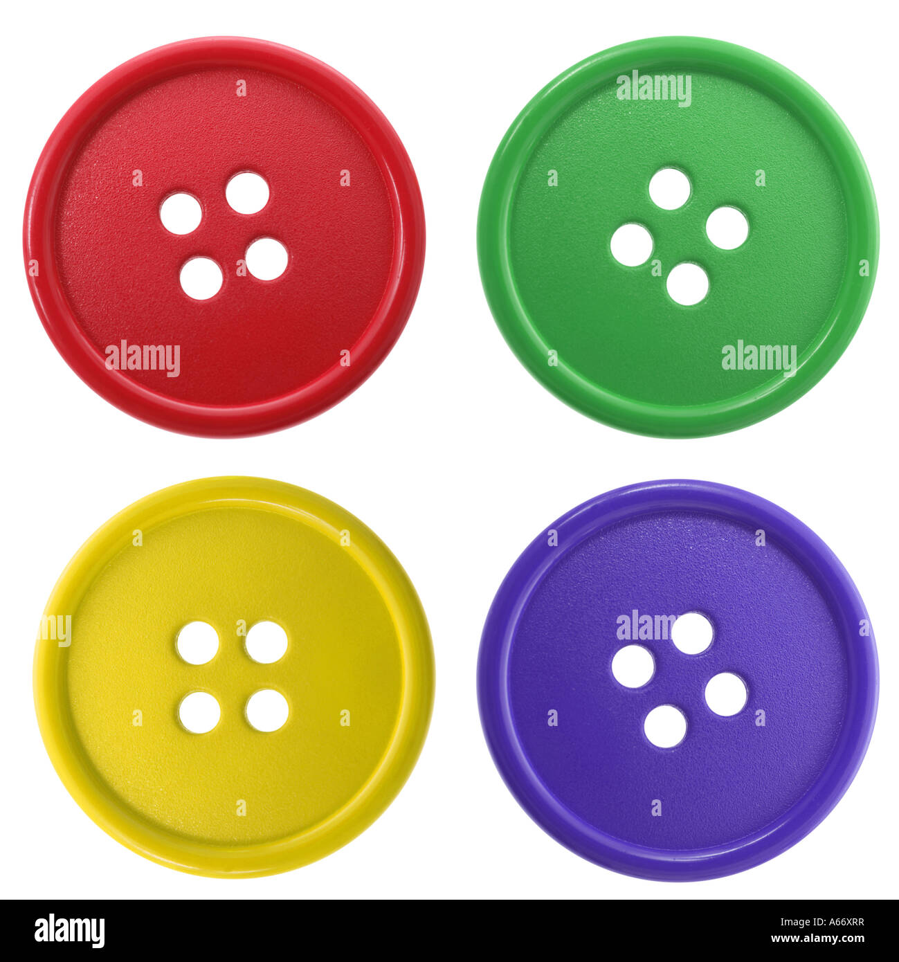 Vier bunte Buttons ausgeschnitten auf weißem Hintergrund Stockfoto