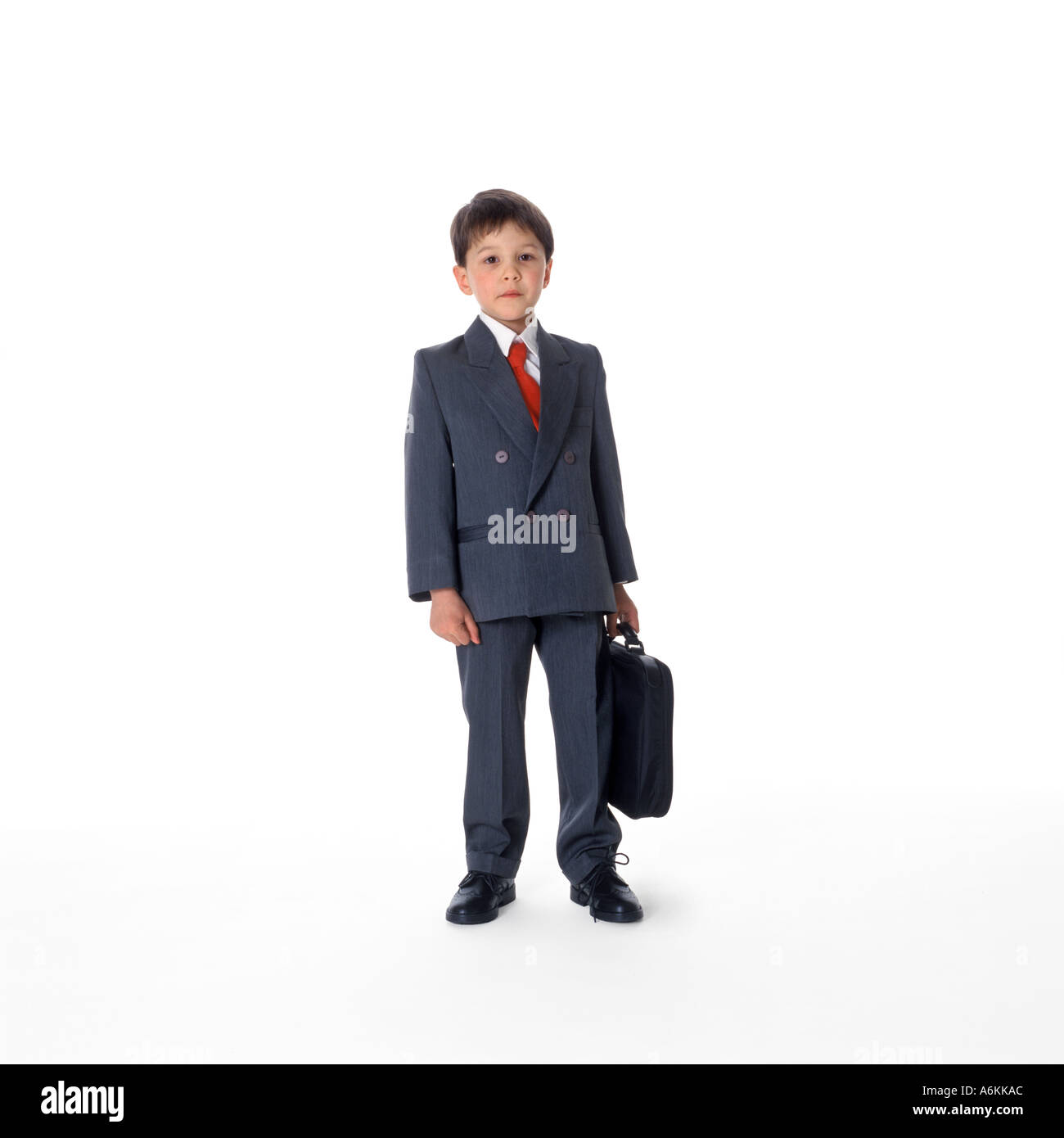 Kleiner Junge gekleidet als Geschäftsmann Stockfoto