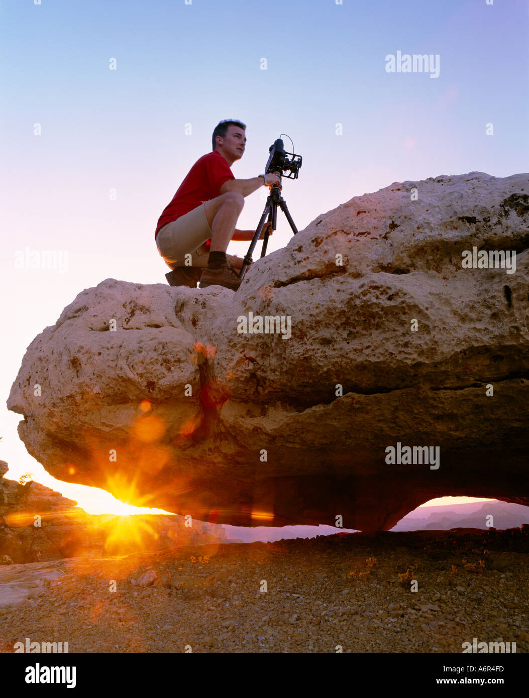 Fotograf auf Rock Grand Canyon Arizona Stockfoto