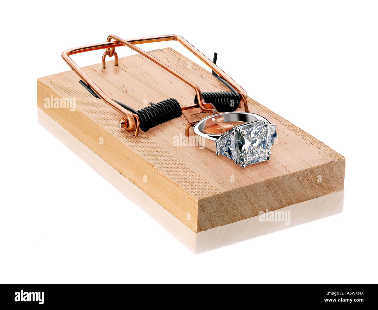 Diamant-Ring auf einer Mausefalle Stockfoto