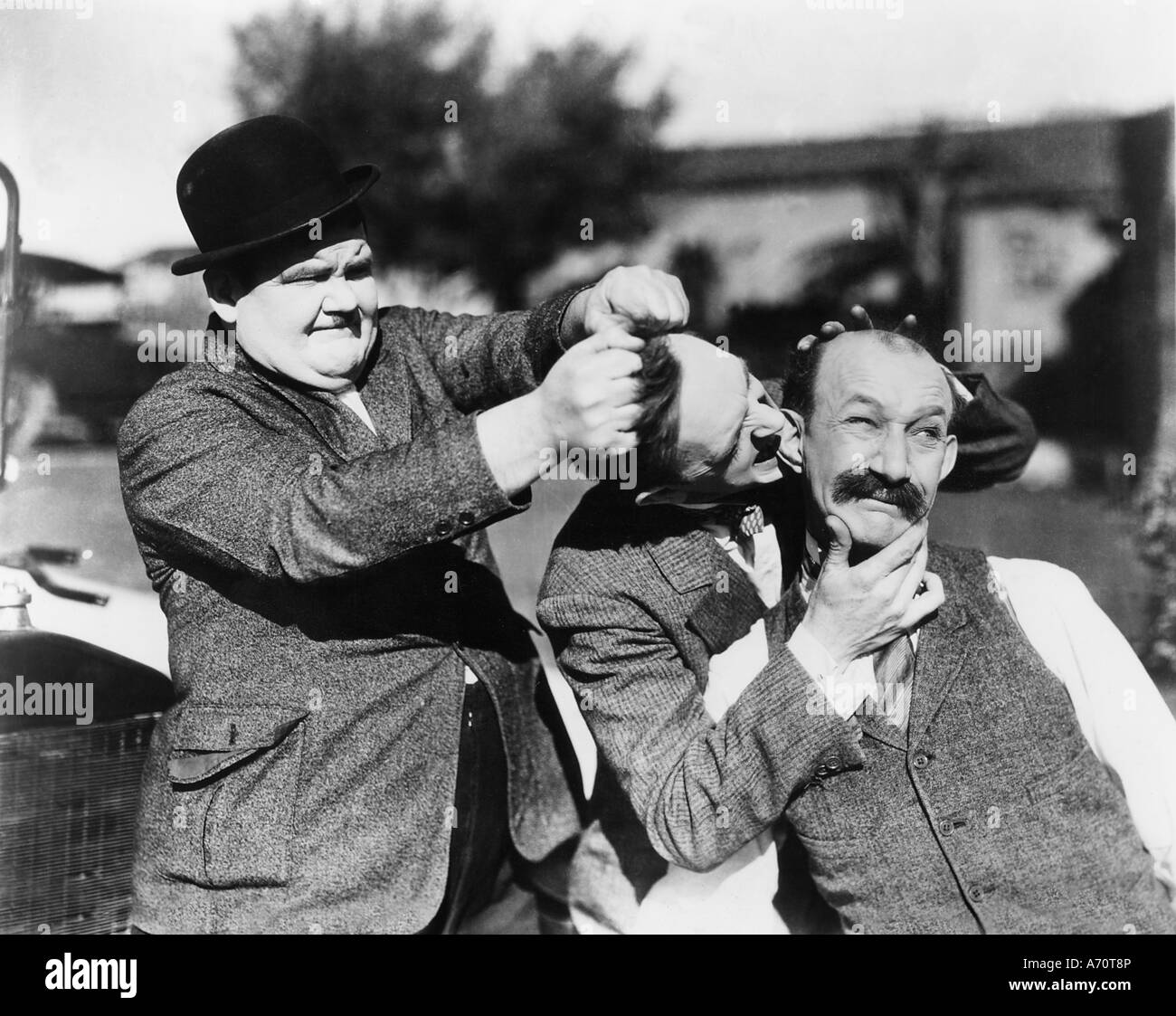 BIG BUSINESS 1929 Hal Roach Stummfilm mit Laurel und Hardy und James Finlayson auf der rechten Seite Stockfoto