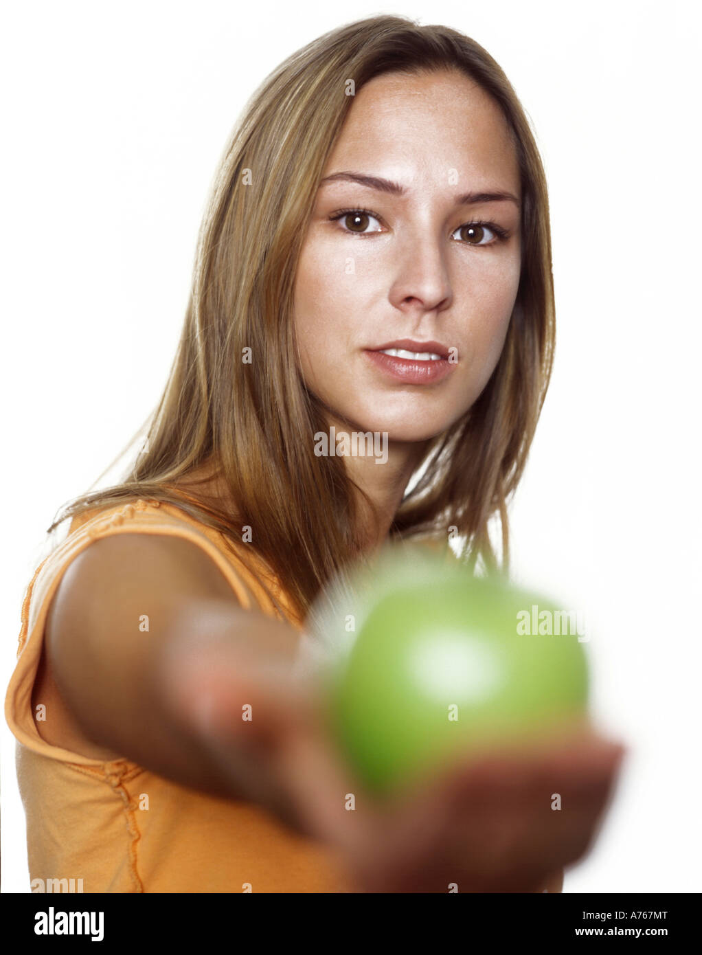 Junge Frau mit grünem Apfel, Cloes-up Stockfoto