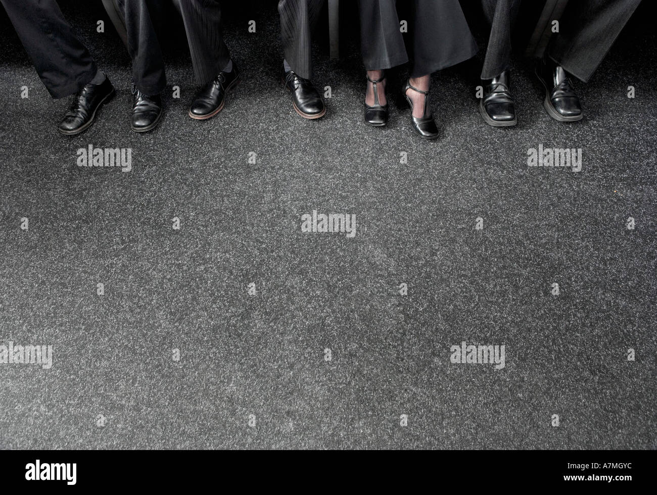 Vier Unternehmer tragen von Schuhen Stockfoto