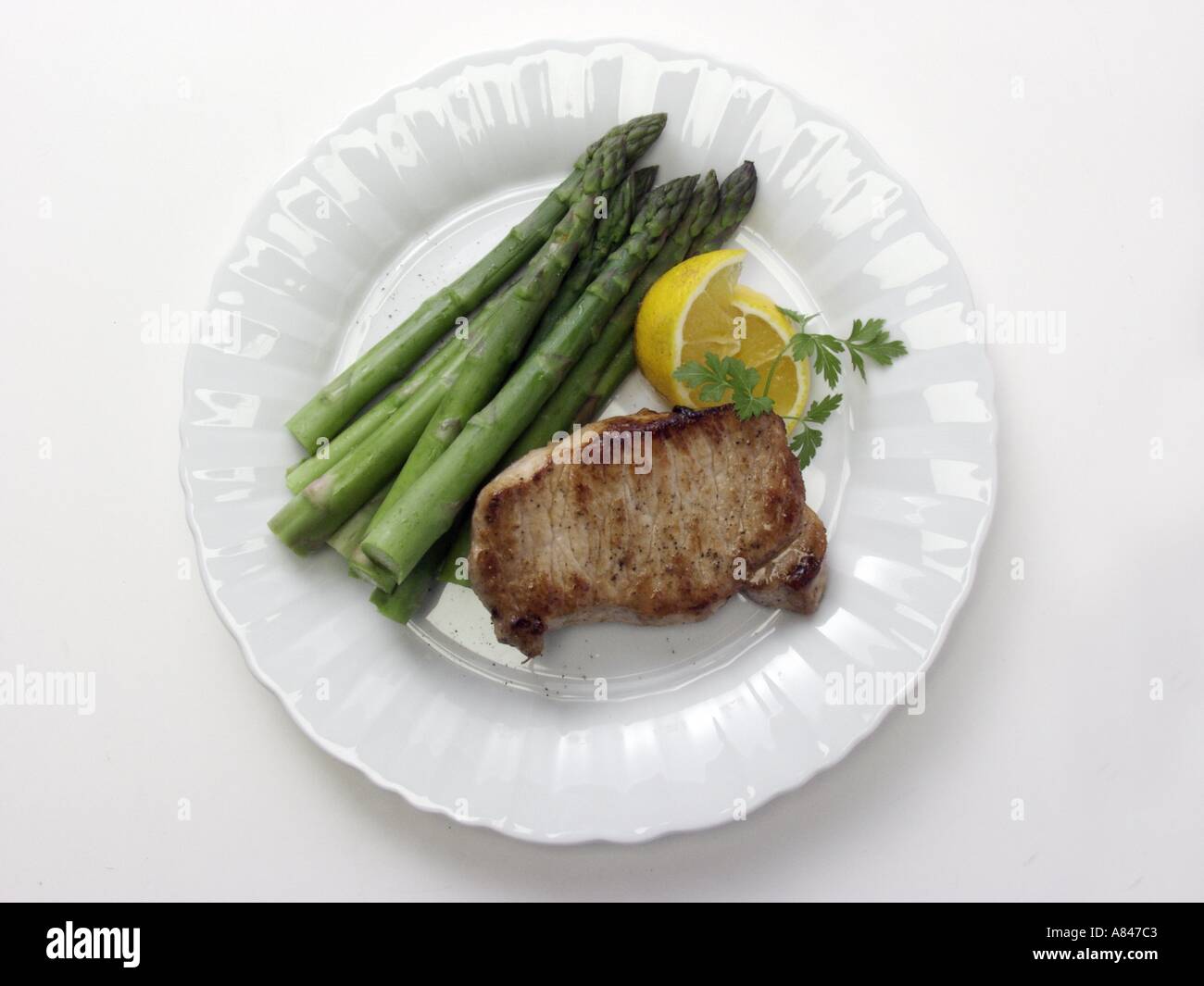 Ohne Knochen Schweinekotelett mit Spargel Stockfoto