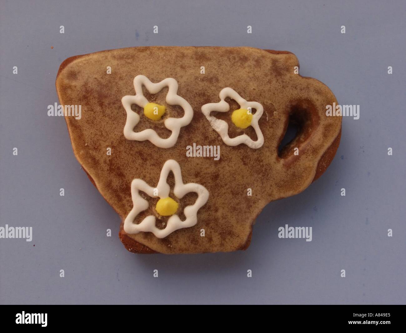 Lebkuchen-Cup mit Blumen Stockfoto