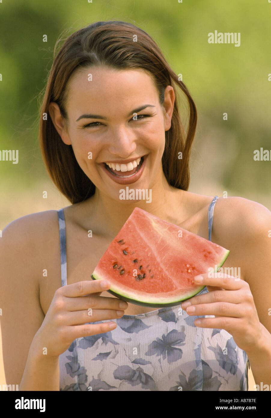 Frau mit Melone Stockfoto