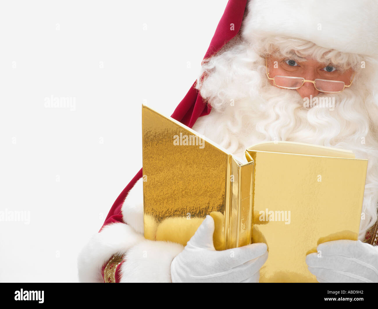 Santa Claus mit einem Buch Stockfoto