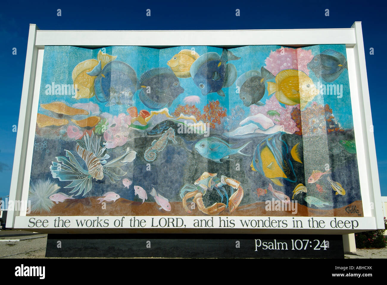 Bemalte Wand mit religiösen Themen in Bonaire Stockfoto