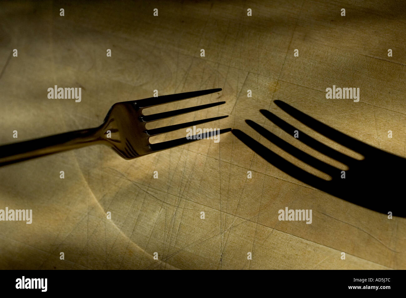 Eine Gabel mit Schatten Essen abstrakt Stockfoto