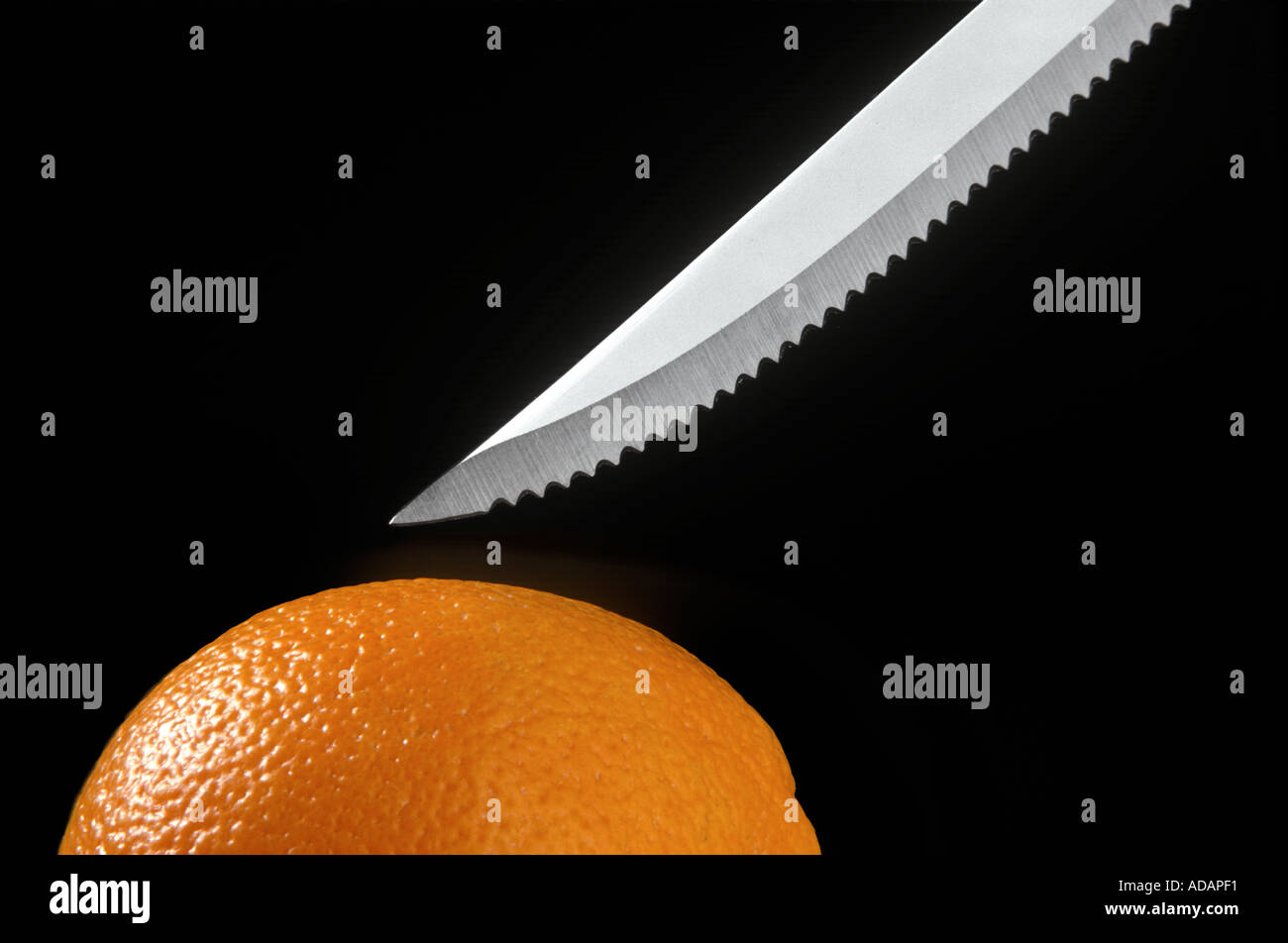 Messer schneiden orange Stockfoto