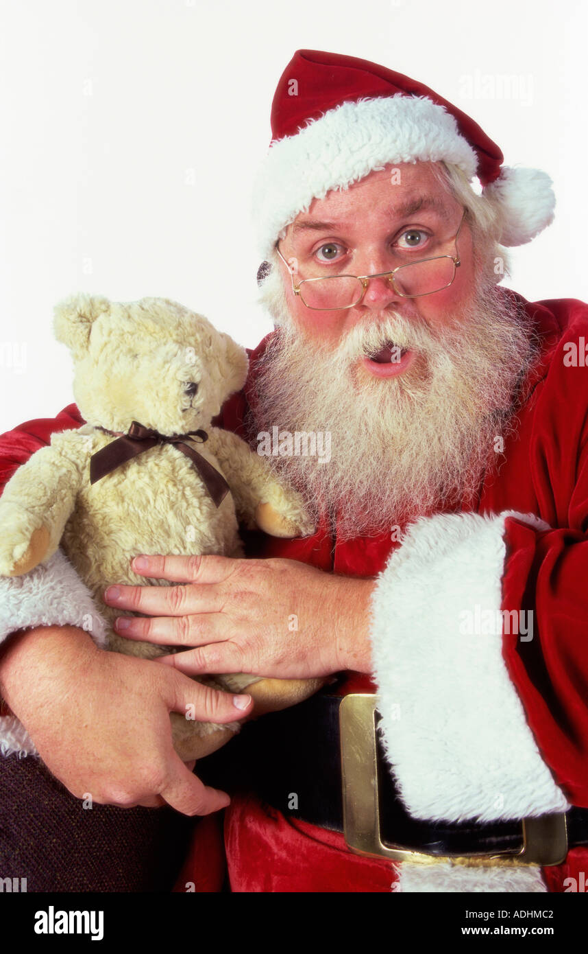 Porträt des Weihnachtsmannes halten einen Teddybär Stockfoto