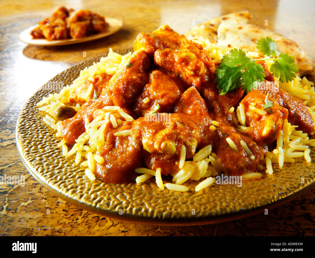Indisches Essen - Huhn Madras-Curry mit Reis Stockfoto