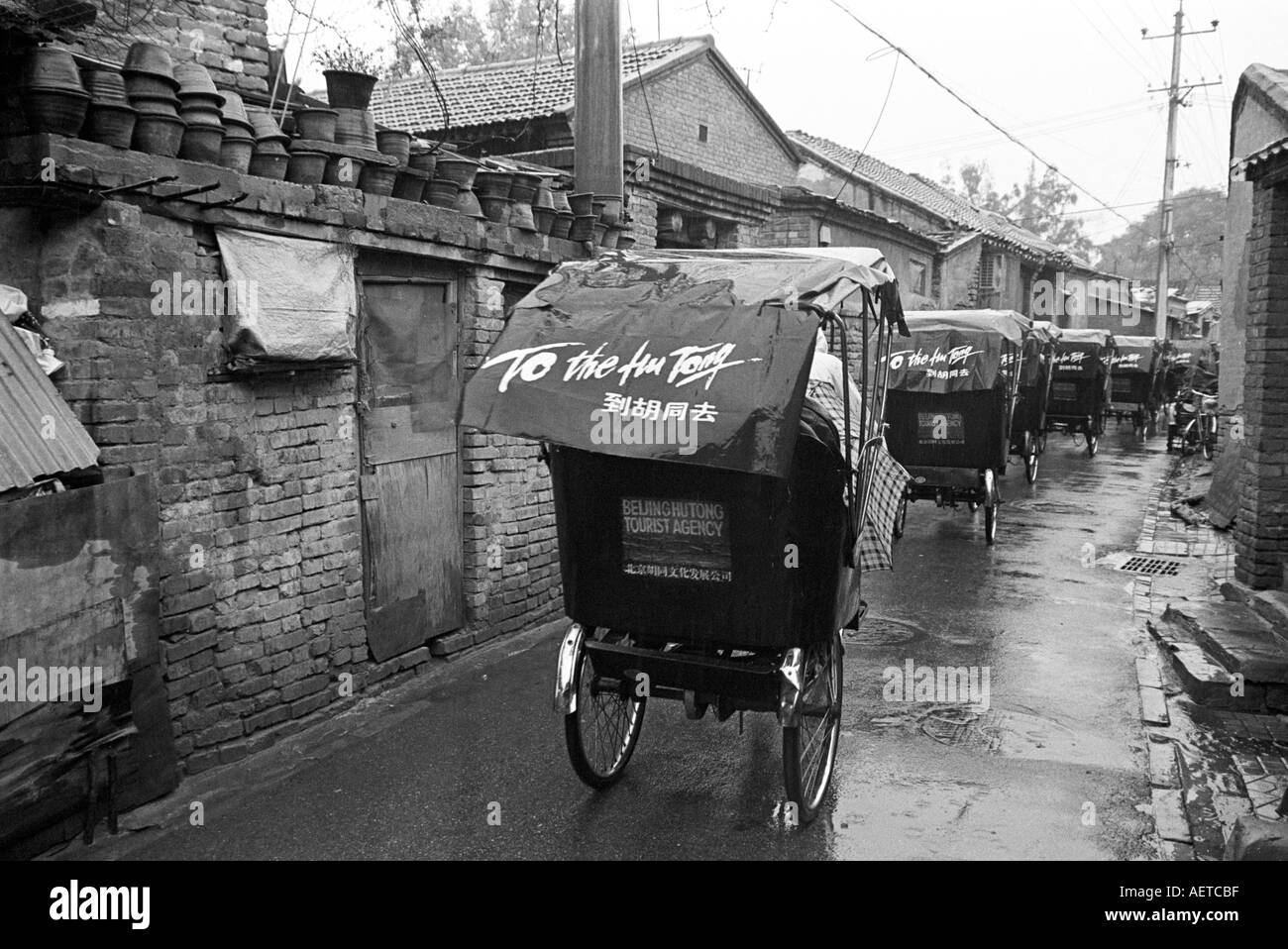 Eine Hutong Tour Gruppe reisen in Fahrrad-Rikschas in Peking 2003 Stockfoto