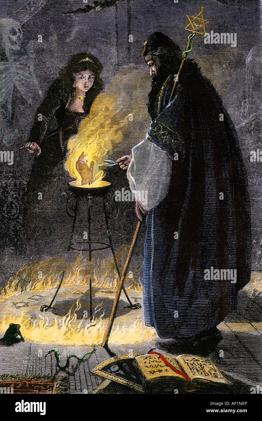 Zauberer evoziert eine Hand im Kreis des Feuers Abbildung. Hand - farbige Holzschnitt Stockfoto