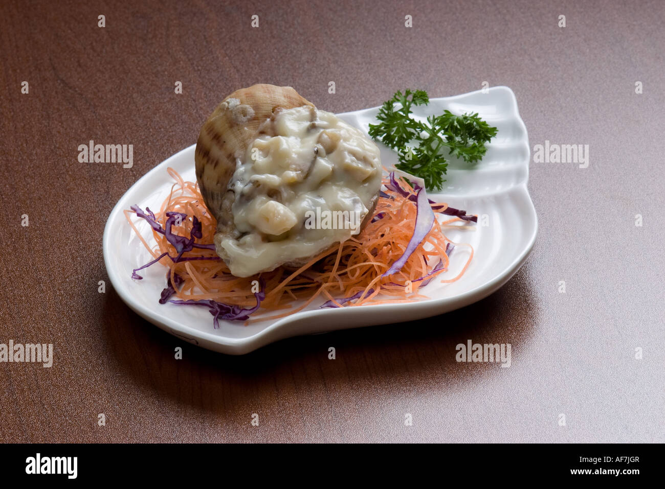 Chinesen essen Meer Wellhornschnecken Stockfoto