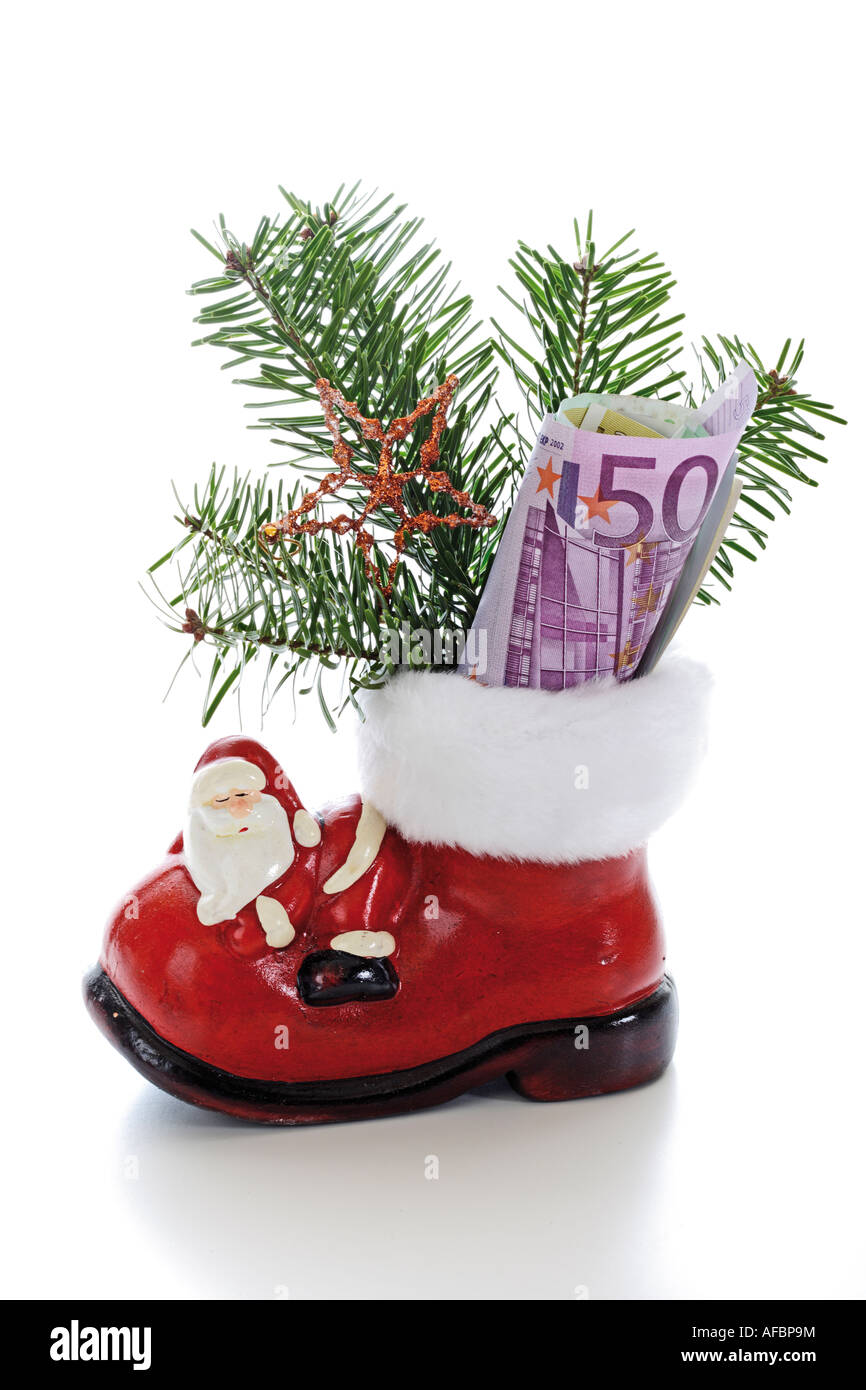 Santa-Boot mit Geld Stockfoto