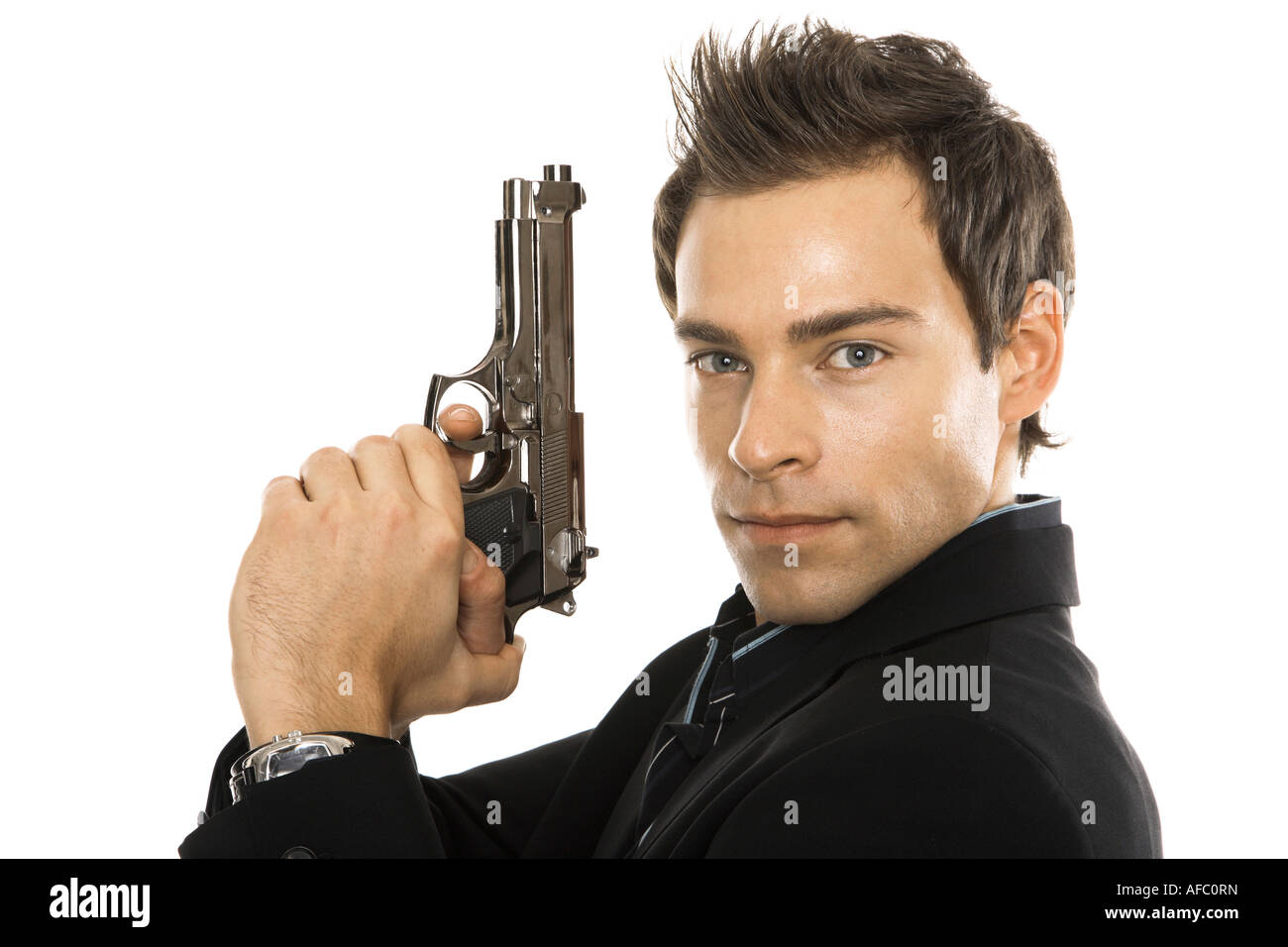 Junger Mann mit Handpistole, close-up Stockfoto