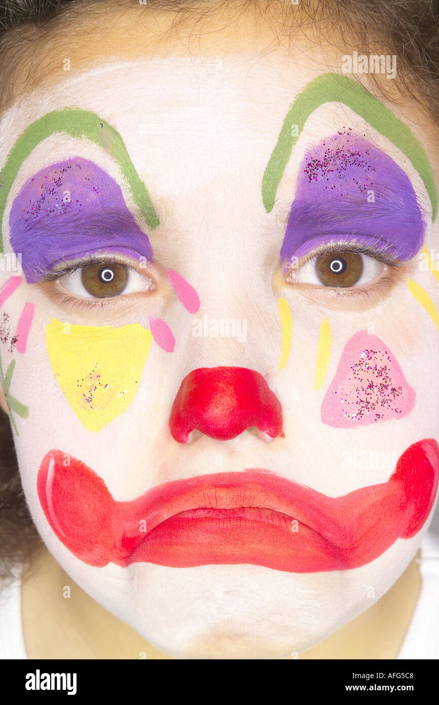 Nahaufnahme eines jungen Mädchens mit traurigen Gesicht gemalt wie clown Stockfoto