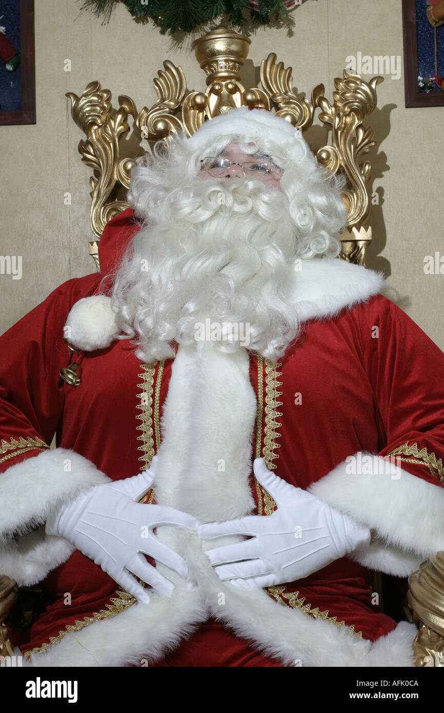 Santa Claus lachend seinen Bauch reiben Stockfoto