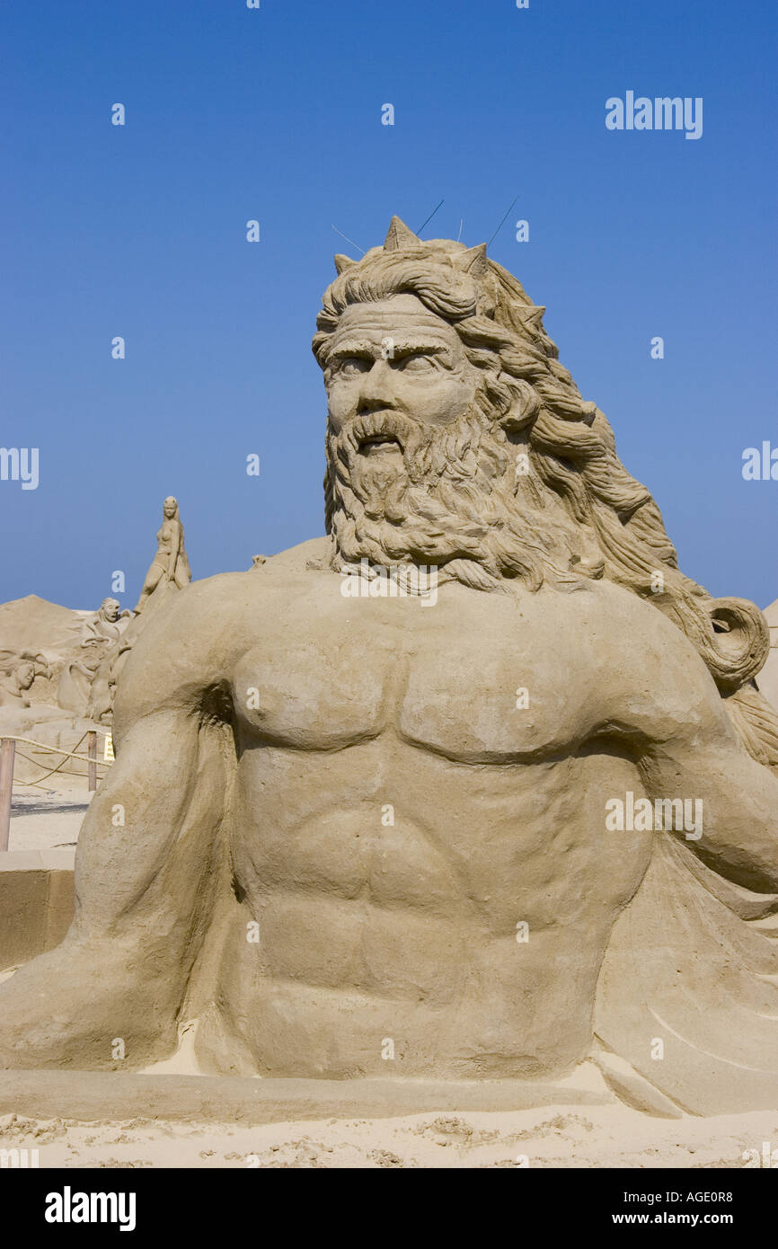 Sandskulpturen von Poseidon, dem antiken griechischen Gott des Meeres, am zentralen Strand von Great Yarmouth angezeigt Stockfoto