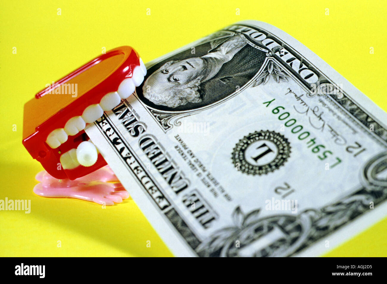 Kunststoff-Windup Spielzeug Mund Essen USA 1 Dollar Bill Stockfoto