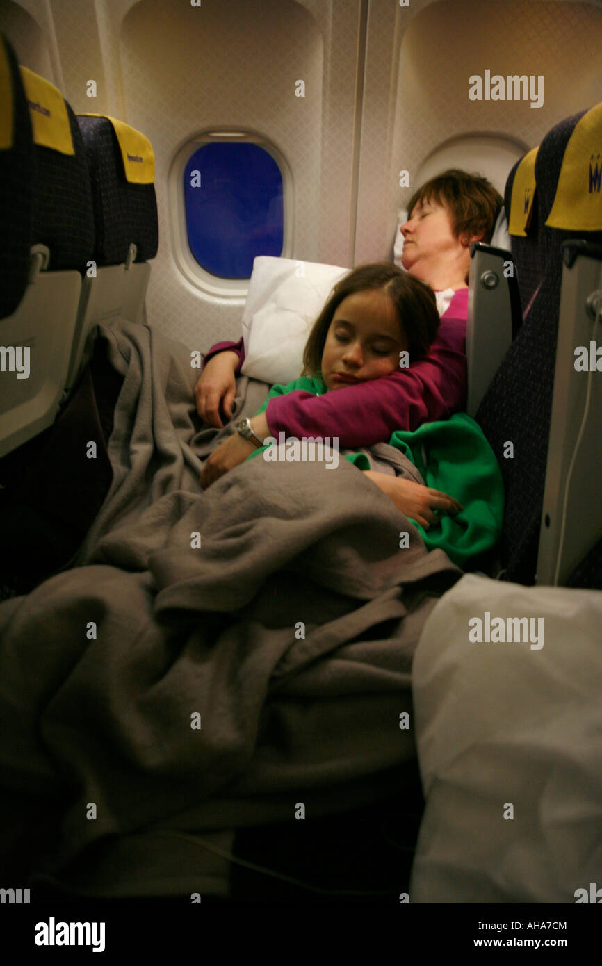 Langstrecken-Reisen eingeschlafen auf Ebene Stockfoto Langstrecken-Reisen eingeschlafen auf Ebene Stockfoto