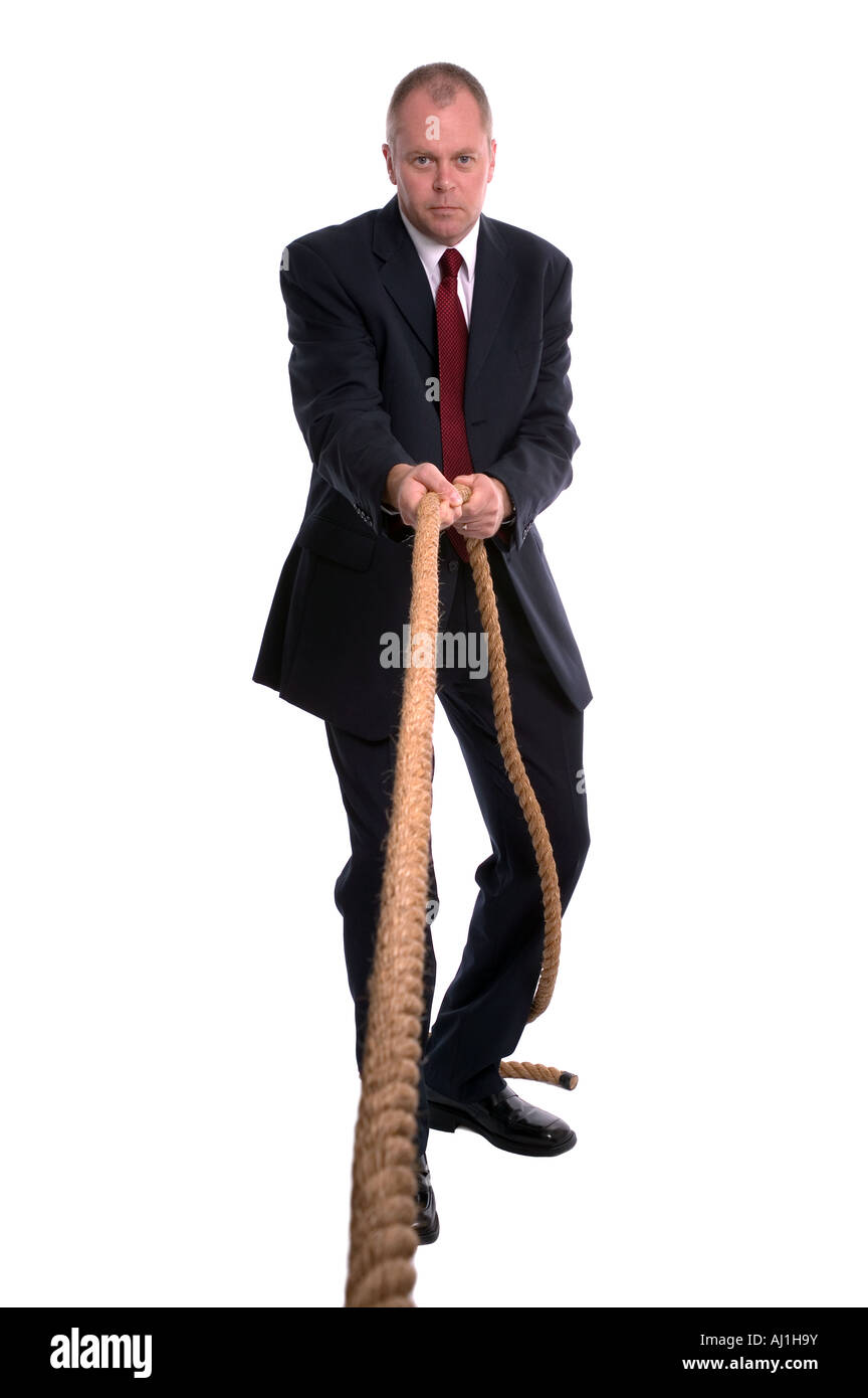Unternehmer, die auf einer Länge von Seil ziehen Stockfoto