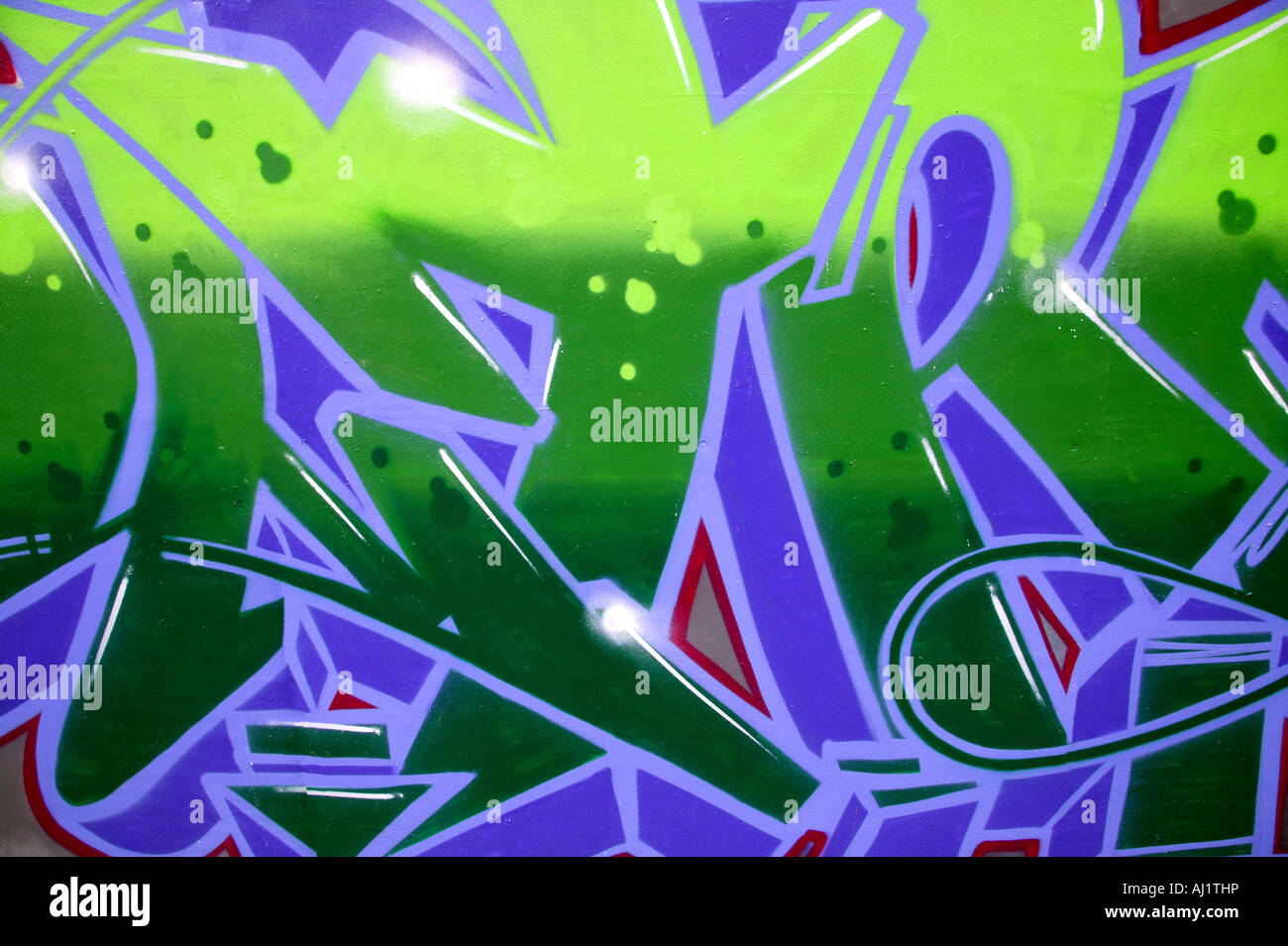 Graffiti-Hintergrund in lebendige Grün und lila Stockfoto