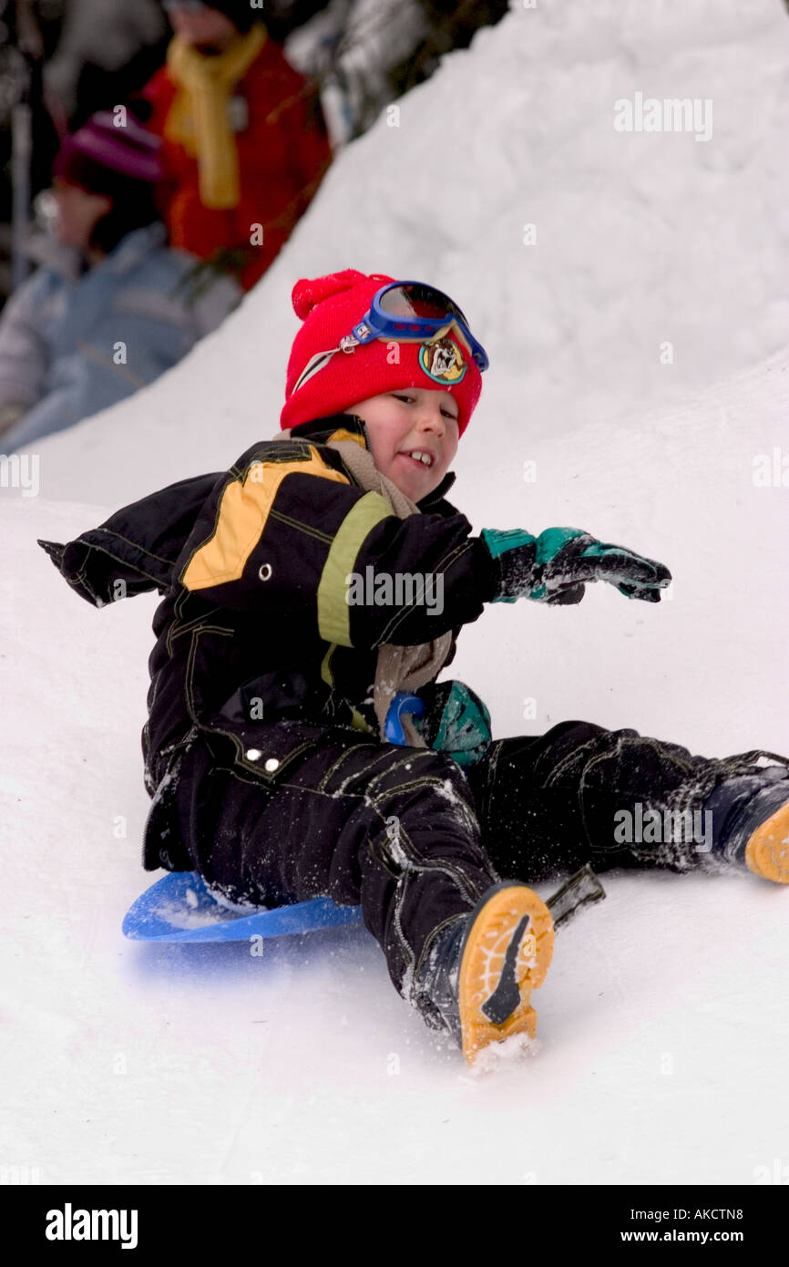 Sleding junge Stockfoto