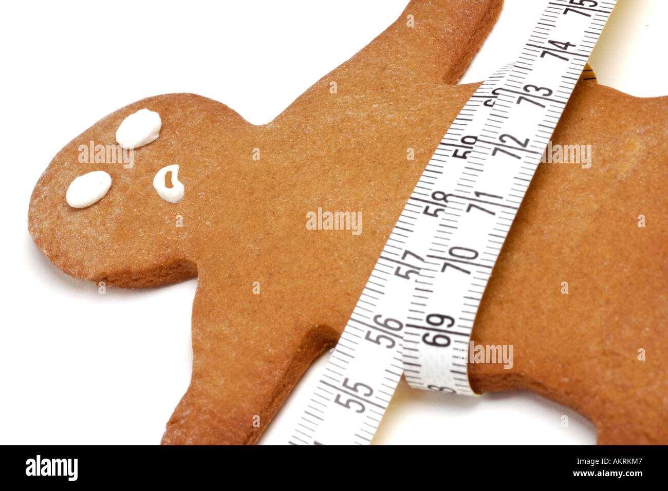 Lebkuchenmann mit Maßband um die Taille Stockfoto