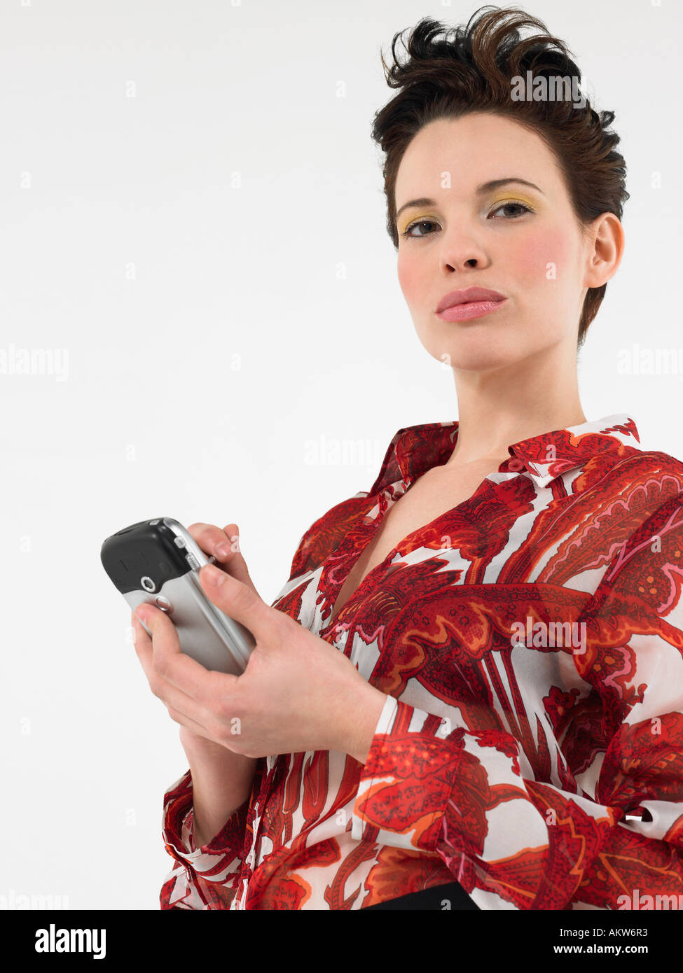 Frau mit PalmPilot im studio Stockfoto