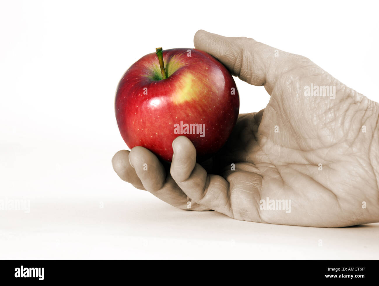 Hand mit glänzenden roten Apfel Stockfoto