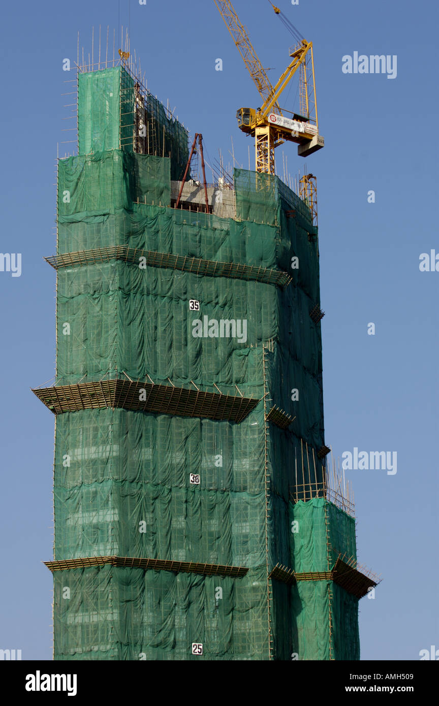 Bambus-Gerüst verwendet für den Bau von einem Wolkenkratzer, Kowloon, Hong Kong, China. Stockfoto