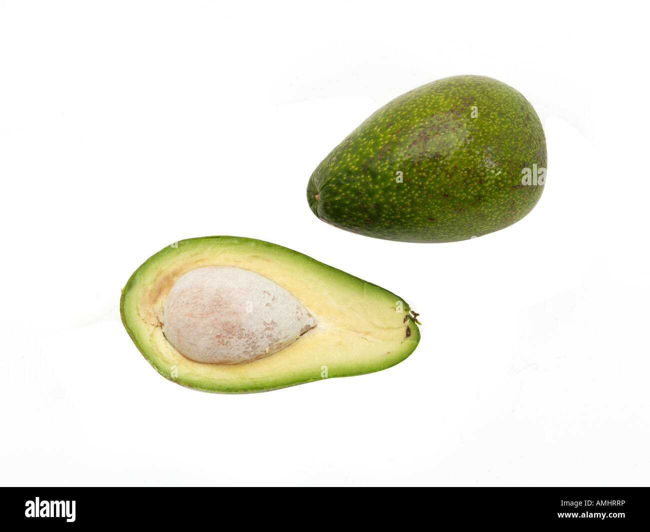 Avocado ganzes & Hälfte Stockfoto